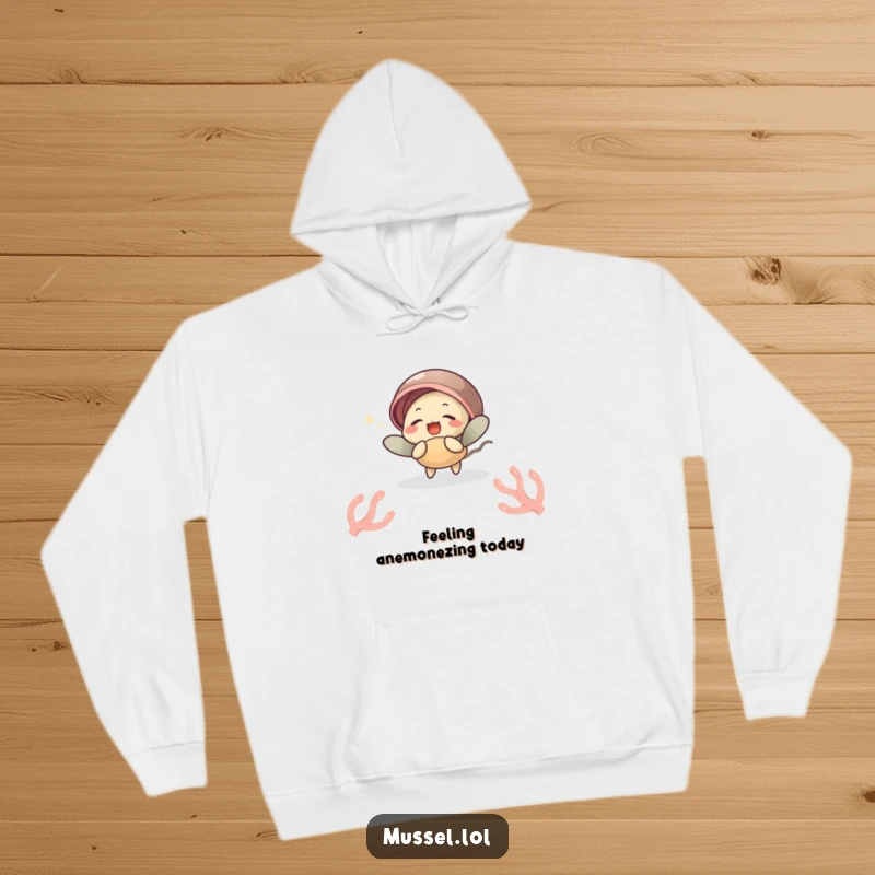 Funny hoodie with a mussel character giggling while being tickled by a sea anemone, offering warmth and ocean-themed humor, a funny gift.
